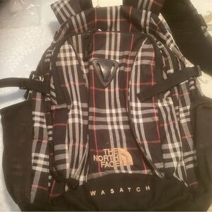 The North Face Black and Red Plaid Backpack